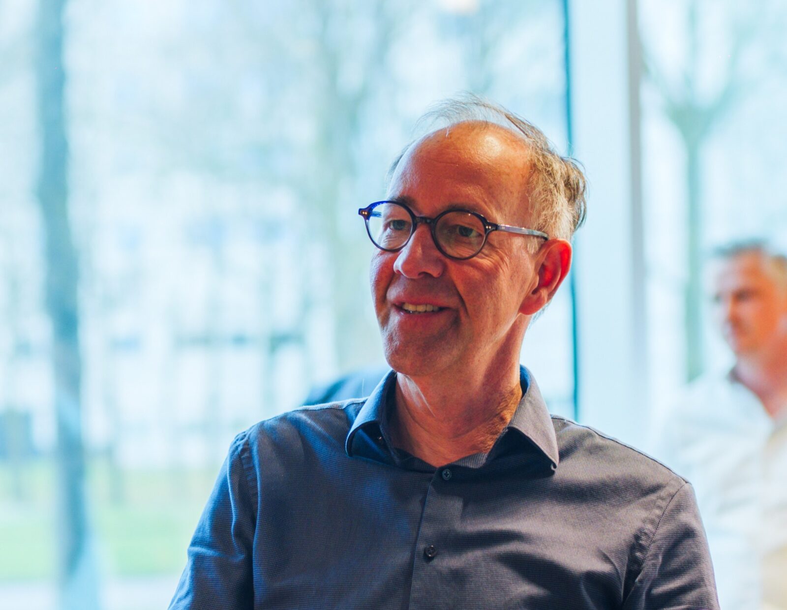 Men employee from Kadans Science Partner smiling